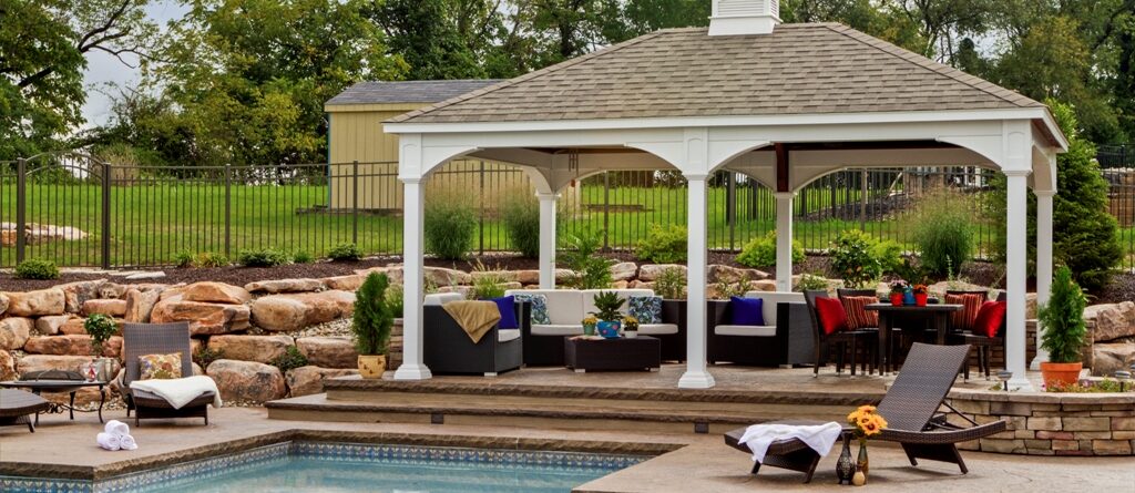 Traditional vinyl gazebo by a pool.