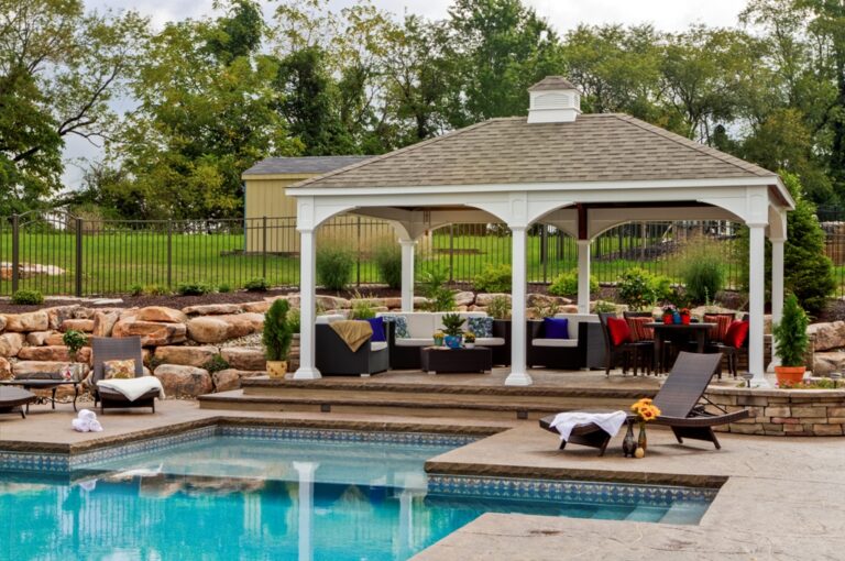 Traditional vinyl gazebo by a pool.
