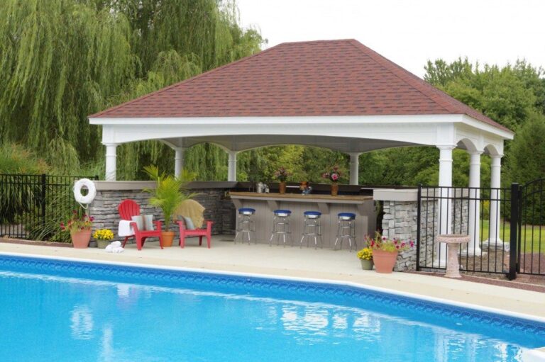 Hampton style, white vinyl pavilion with bar style outdoor kitchen and seating.