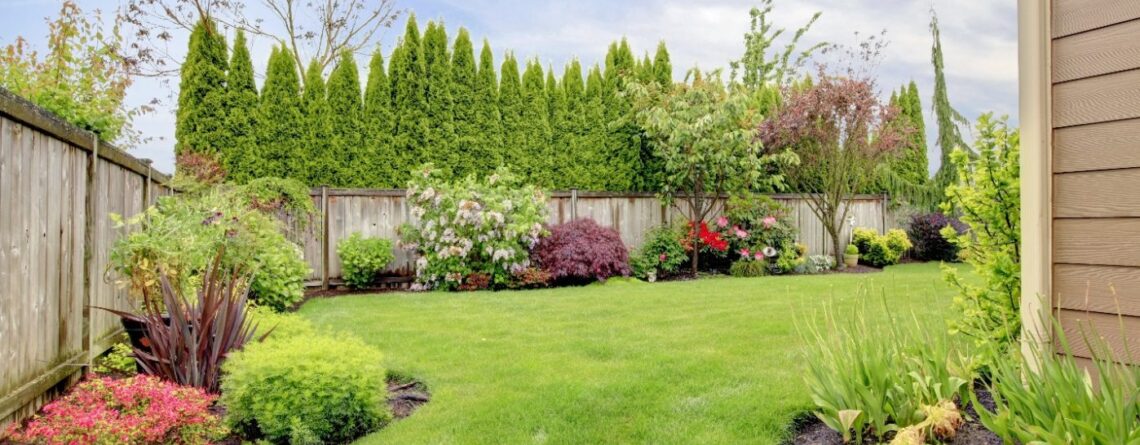 Well manicured, fenced in yard and garden.