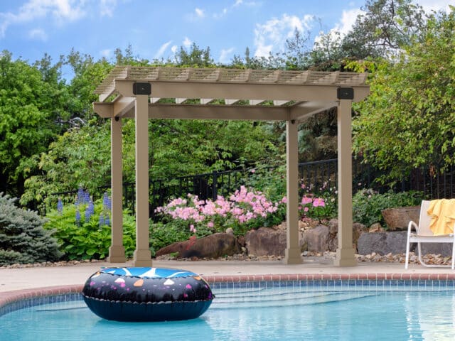 a pool with a float and a pergola