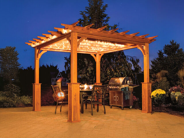 a wooden pergola with lights