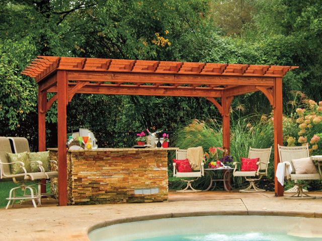 a pool with a bar and chairs with a wood pergola