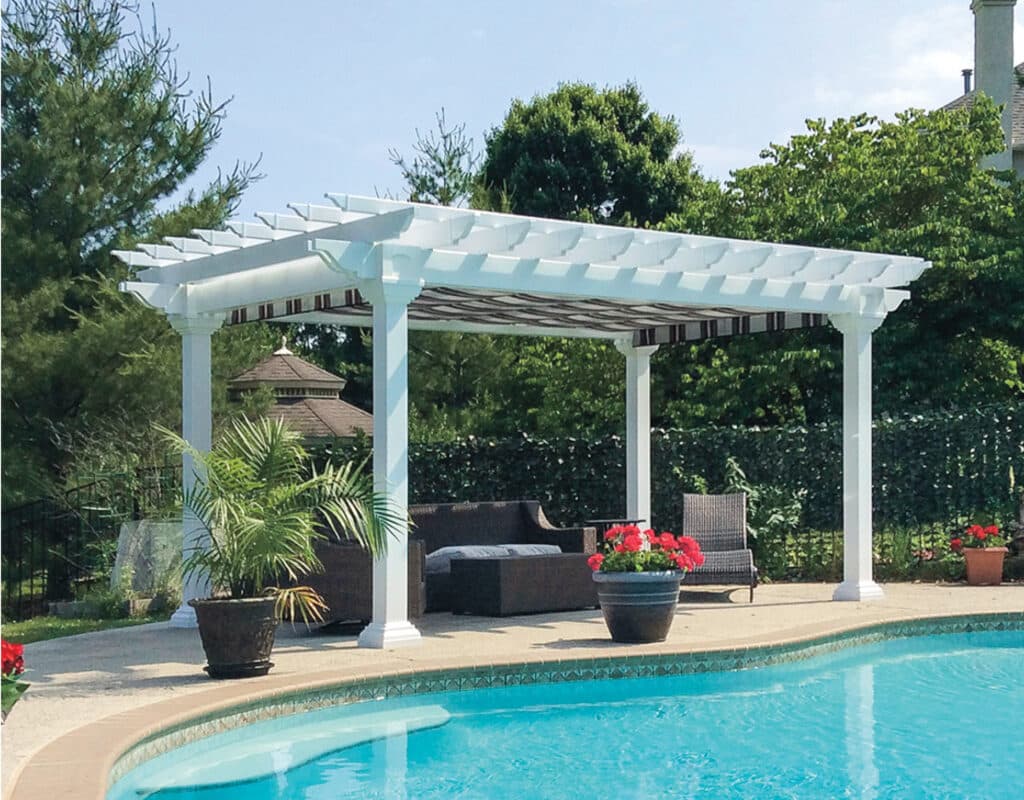 a pool with a white cover and chairs and a white pergola