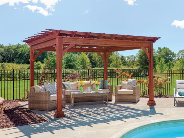 a patio with a pool and a pergola