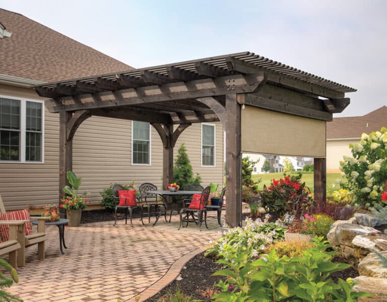 14'x16' Kingston(B)_ a patio with a covered table and chairs with a wood pergola