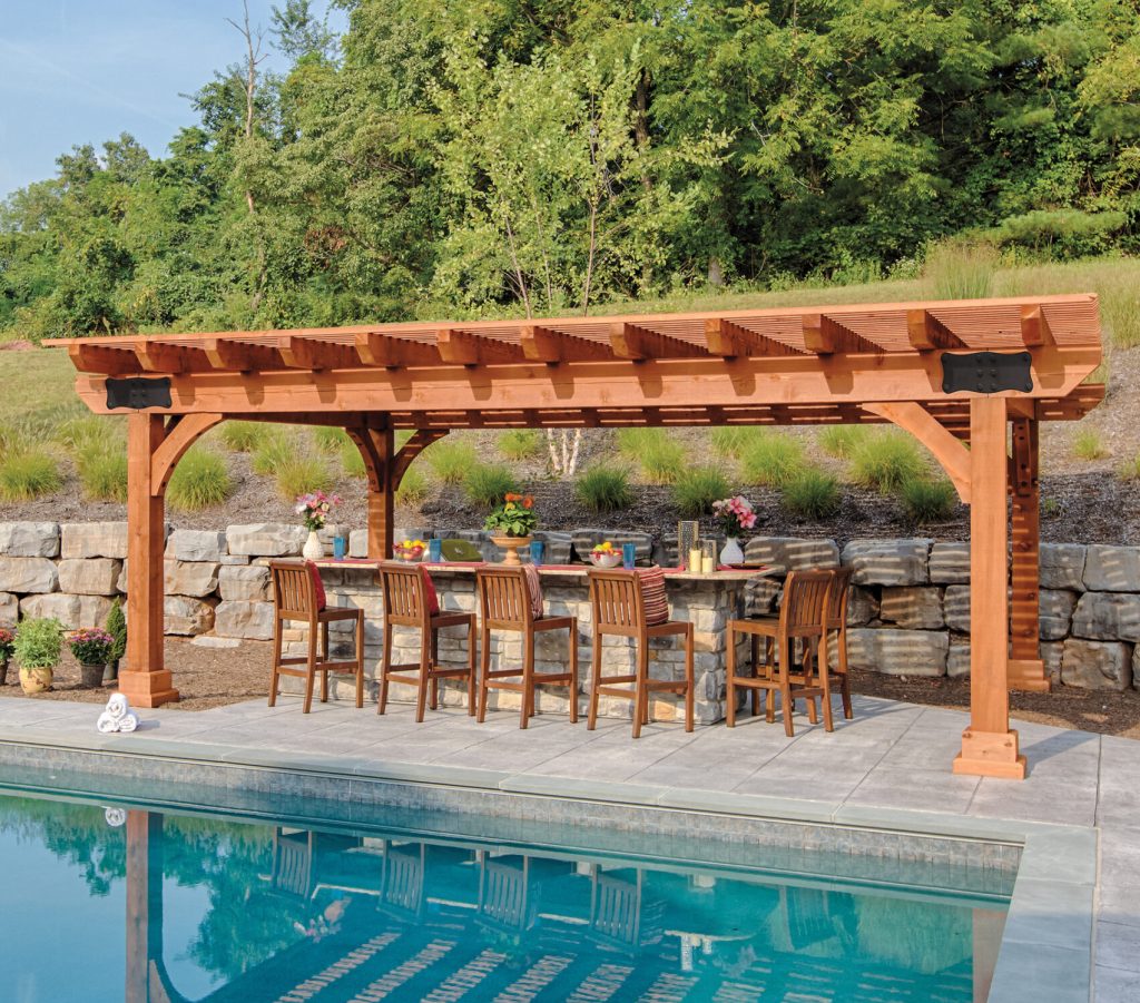 a pool with a table and chairs and a large sturdy 16x22 pergola