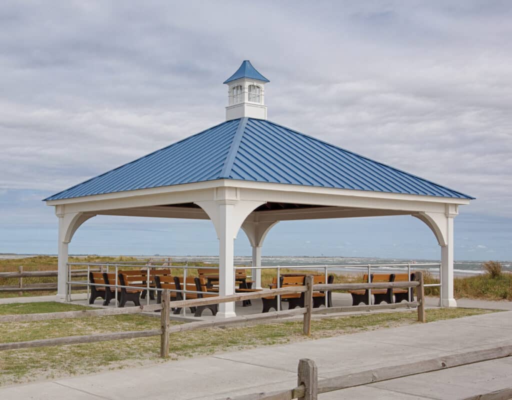 Large commercial pavilion with blue roof and a blue roof on the beach